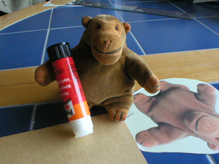 Mr Monkey gluing the printed monkey onto card