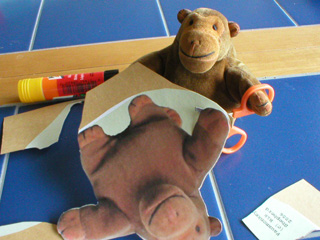 Mr Monkey cutting out the faux monkey