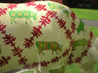 Detail of the small patterened green and yellow cows