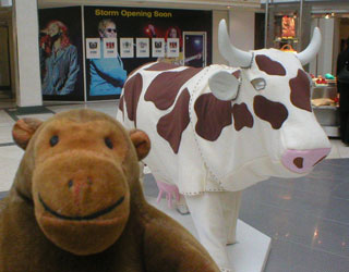 Mr Monkey with a cow wearing a pantomime cow suit
