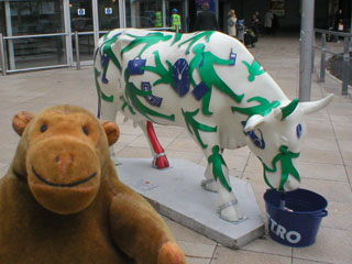 Mr Monkey with the same cow covered in green figures