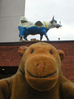 Mr Monkey in front of a cow-plane