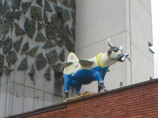 A cow with wings, tail, propellor and guns, painted white and blue, sporting Royal Air Force roundels