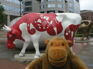 Mr Monkey with a white cow with red intruments on it