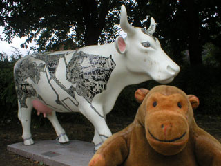 Mr Monkey with a white cow decorated in black and white