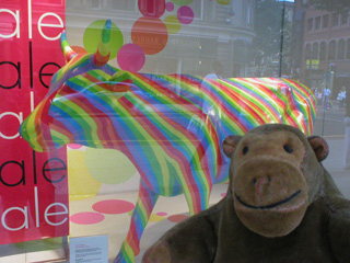 Mr Monkey getting closer to the rainbow striped cow