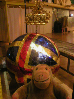 Mr Monkey examining the giant glitter ball during the interval