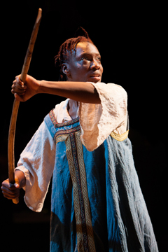 Lizaveta (Ony Uhiara) posing for an icon (Royal Exchange Theatre production photo)