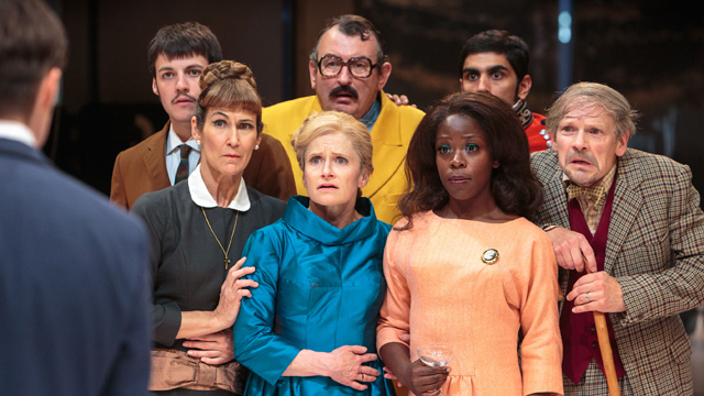 Dyfan Dwyfor holds Calum Finlay, Carla Mendonça, Richard Braine, Haley Carmichael, Debbie Korley, Dharmesh Patel and Nick Haverson at bay (Royal Exchange Theatre production photo)