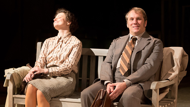 Enid (Anna Francolini) and Jimmy (Dean Andrews) on a bench in Piccadilly Gardens (Royal Exchange Theatre production photo)