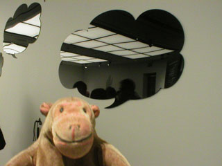 Mr Monkey posing with a reflection filled speech bubble
