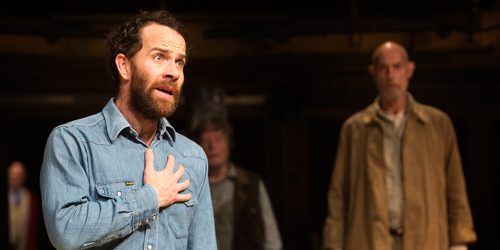 Jonjo O'Neill as John Proctor with Sam Cox as Giles Corey (Royal Exchange Production photo by Jonathon Keenan)