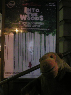 Mr Monkey looking at the Into The Woods poster