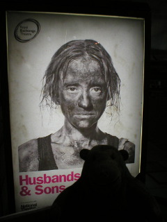 Mr Monkey looking at the Husbands and Sons poster