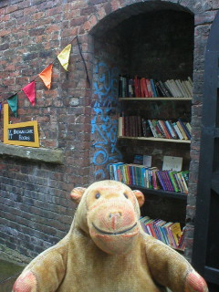 Mr Monkey swapping a book at Backwallgate Books