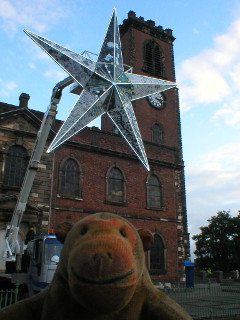 Mr Monkey watching the Star rise in front of the church