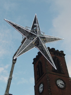 The Star rising in front of the church tower