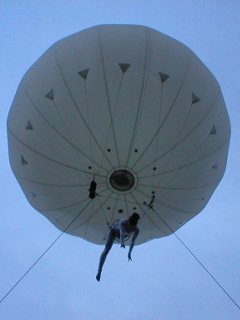 The moon, with the acrobat facing downwards