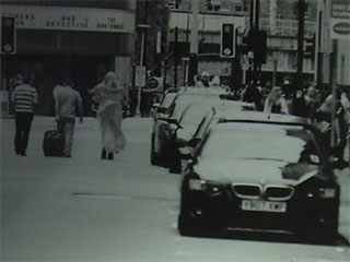 Detail of a picture of three Pride marchers walking in the middle of Whitworth Street