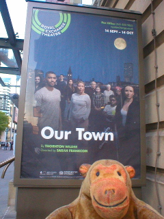Mr Monkey looking at the poster for Our Town
