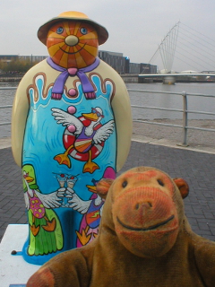 Mr Monkey looking at the Six Geese a-Laying snowman
