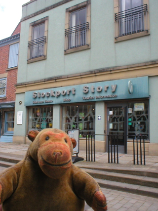 Mr Monkey outside the Stockport Story