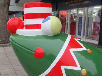 Rudelf's red nose, stripy hat and collar of bells