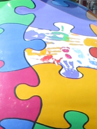 Jigsaw pieces on Foster the Frog's back