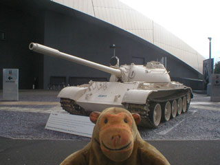 Mr Monkey looking at a captured Iraqi T-55 tank