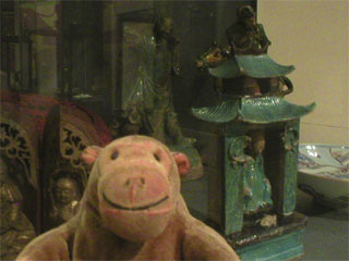 Mr Monkey examining portable shrines and protective ridge tiles