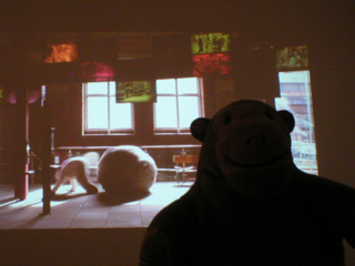 Mr Monkey watching the MOSI section of the Utopia Group video