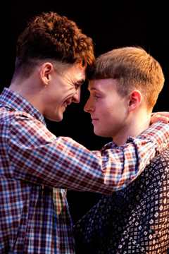 Ste (Tommy Vine) and Jamie (Matthew Tennyson) embrace (Royal Exchange Theatre production photo)