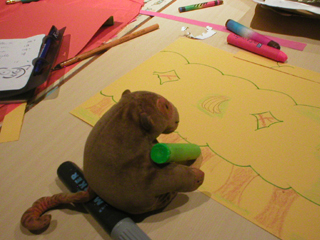 Mr Monkey drawing and colouring his lantern