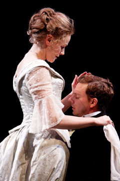 Jean (Joe Armstrong) kneels before Miss Julie (Maxine Peake)  (Royal Exchange Theatre production photo)