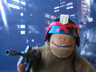 Mr Monkey preparing to dispense justice with his Lawgiver