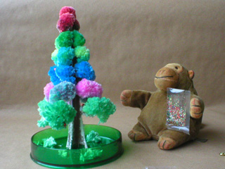 Mr Monkey throwing glitter onto his tree