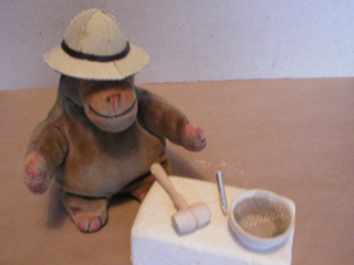 Mr Monkey with his hammer, chisel and solar topee