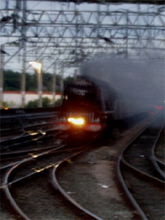 The Duchess of Sutherland pulling the Scarborough Flyer into Stockport station at dusk