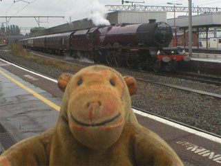 Mr Monkey watching the Scarborough Flyer stopping at Stockport station