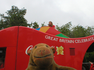 Mr Monkey watching one of the official sponsor trucks