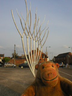 Mr Monkey looking at the completed and unfenced sculpture