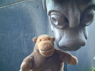 Mr Monkey beside a gargoyle