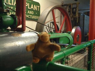 Mr Monkey in front of a steam engine