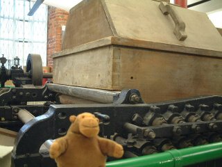 Mr Monkey by a modern planking machine