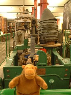 Mr Monkey in front of a blocking machine