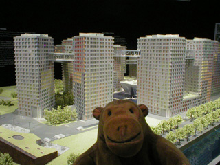 Mr Monkey examining a model of Grand Moma