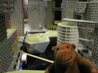 Mr Monkey examining a model of Grand Moma