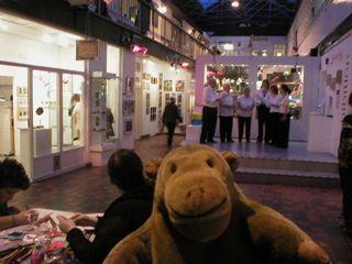 Mr Monkey watching some singers at the Craft and Design Centre