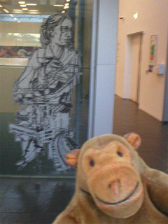 Mr Monkey looking at Swoon cutouts on the BALTIC lifts