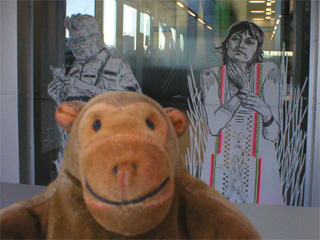 Mr Monkey looking at Swoon cutouts on the BALTIC lifts